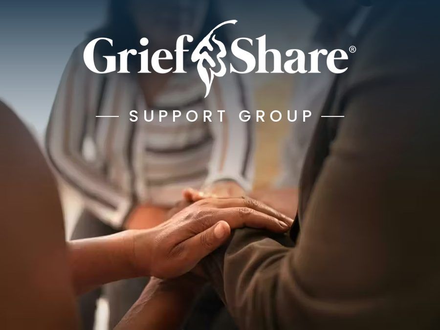 GriefShare Support Group logo above a hand resting on another person's hand in a support group